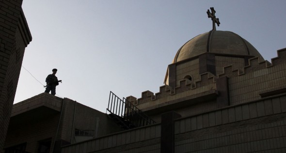 An Iraqi security officer stands guard atop the Church of Our Lady of the Sacred Heart during Christmas mass (PHOTO: Prashant Rao) An Iraqi security officer stands guard atop the Church of Our Lady of the Sacred Heart during Christmas mass (PHOTO: Prashant Rao)